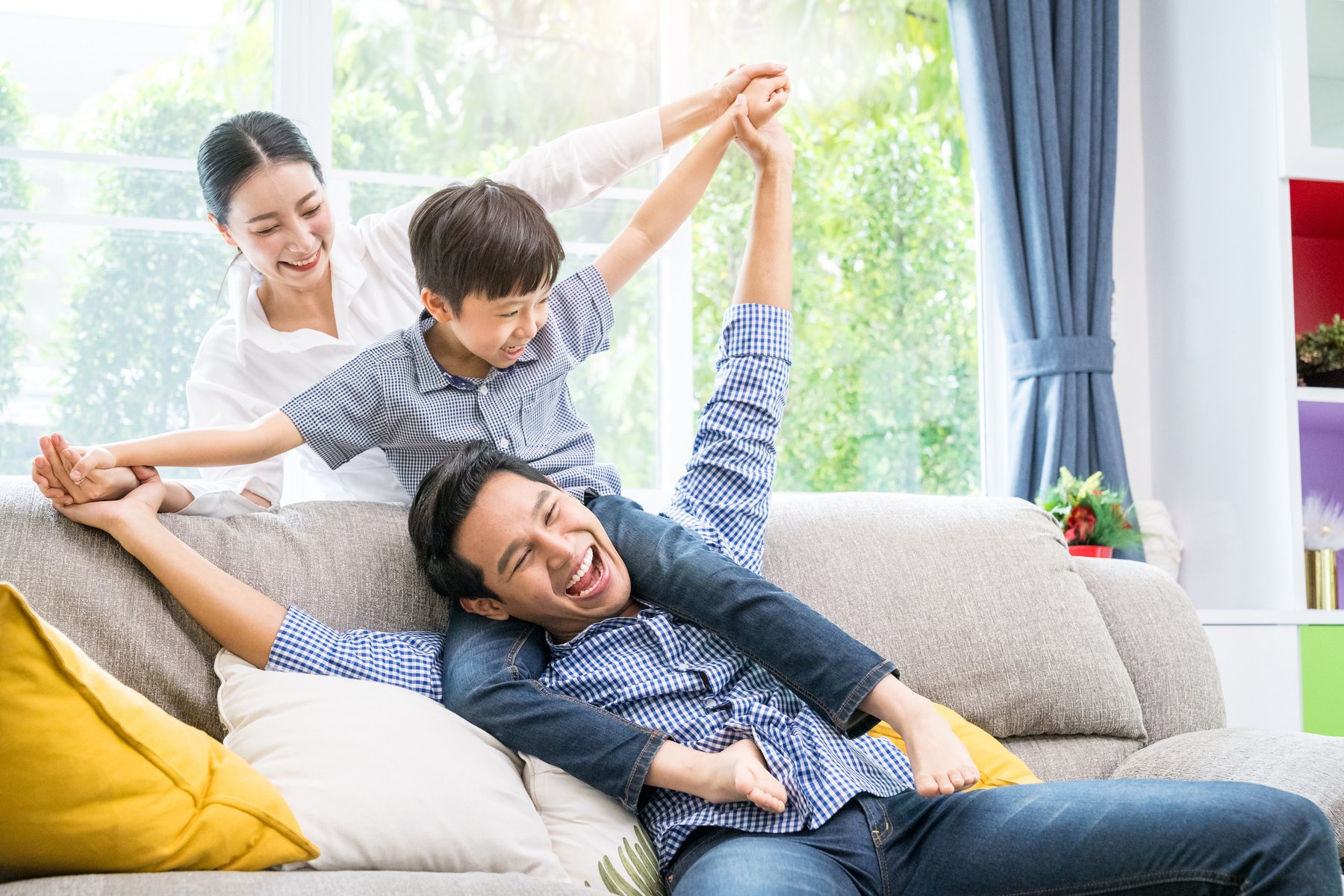 Happy Asian family in the living room